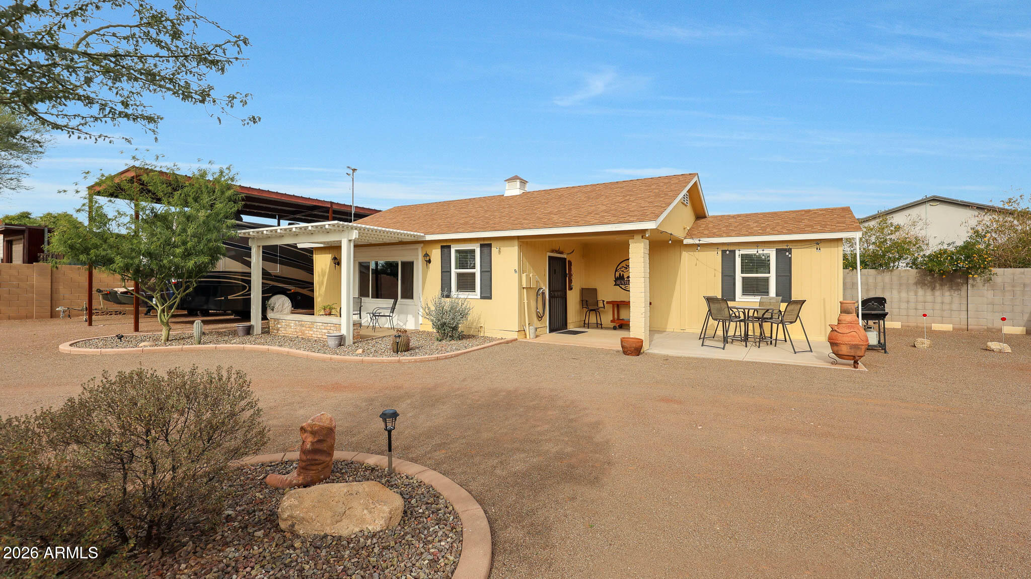 8120 West Williams Road Peoria, AZ 85383 - Photo 31 of 46 a view of a house with backyard and sitting area