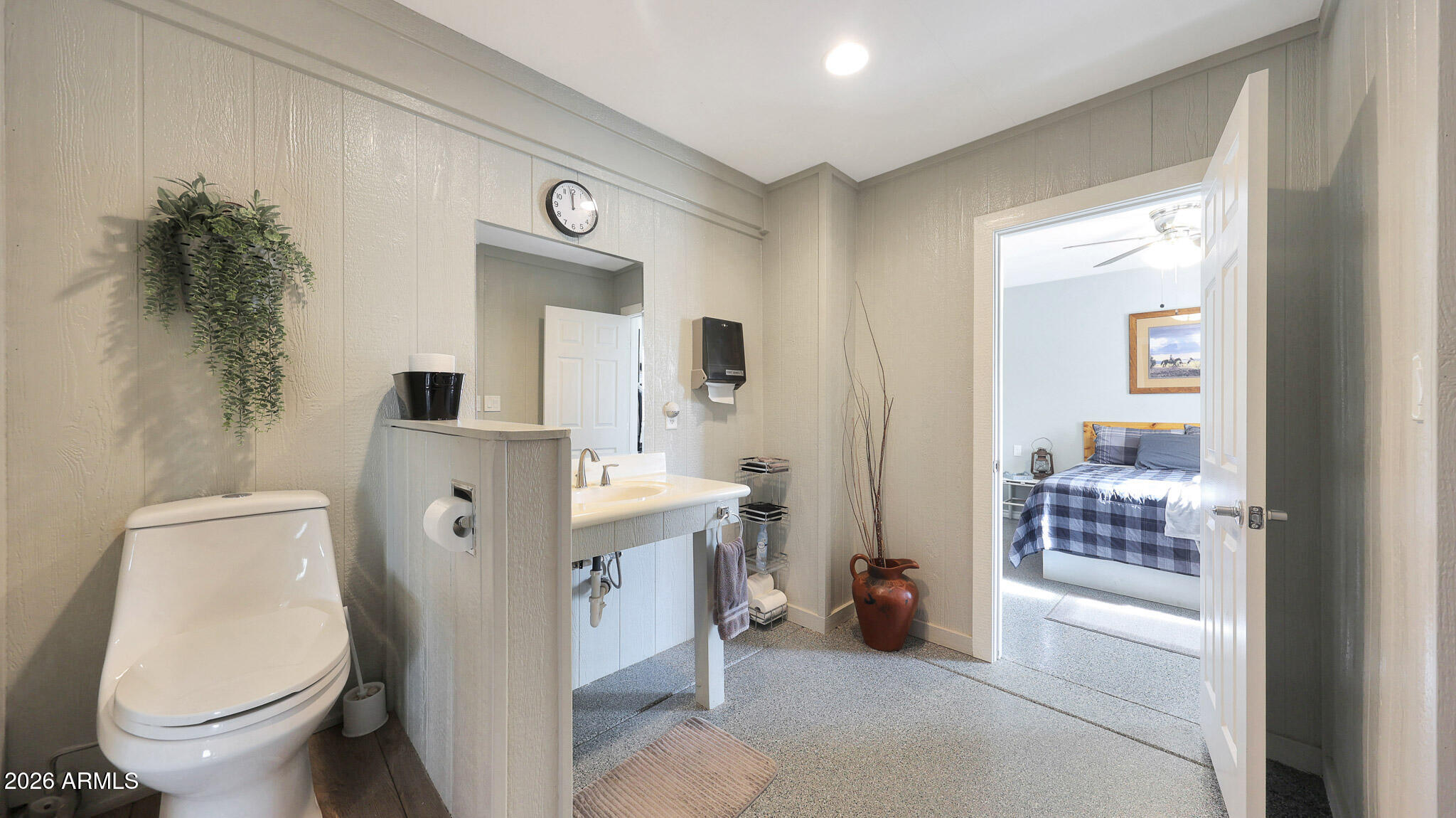 8120 West Williams Road Peoria, AZ 85383 - Photo 37 of 46 a spacious bathroom with a toilet and a sink