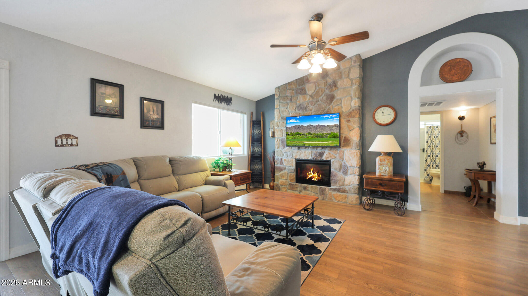 8120 West Williams Road Peoria, AZ 85383 - Photo 9 of 46 a living room with furniture and a fireplace
