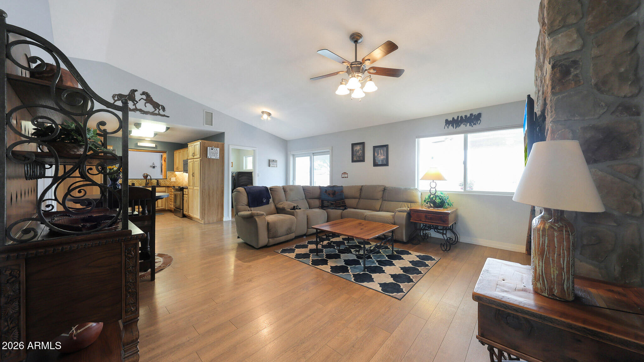8120 West Williams Road Peoria, AZ 85383 - Photo 10 of 46 a living room with furniture and a lamp