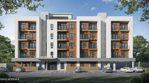 a kitchen with a refrigerator a sink a stove and white cabinets