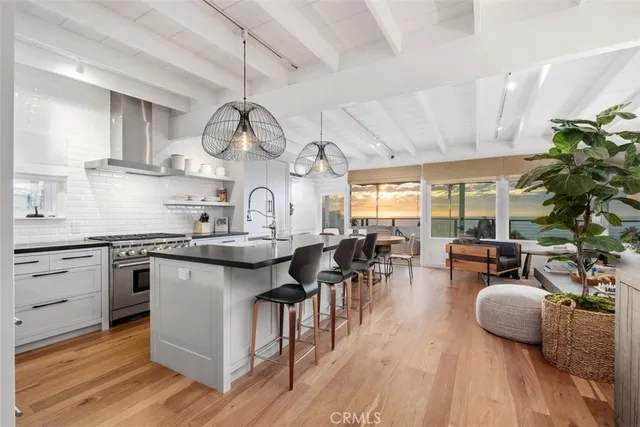 a kitchen with lots of counter top space and wooden floor