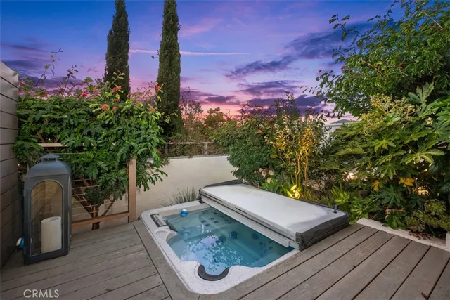 a view of a yard with furniture and a potted plant