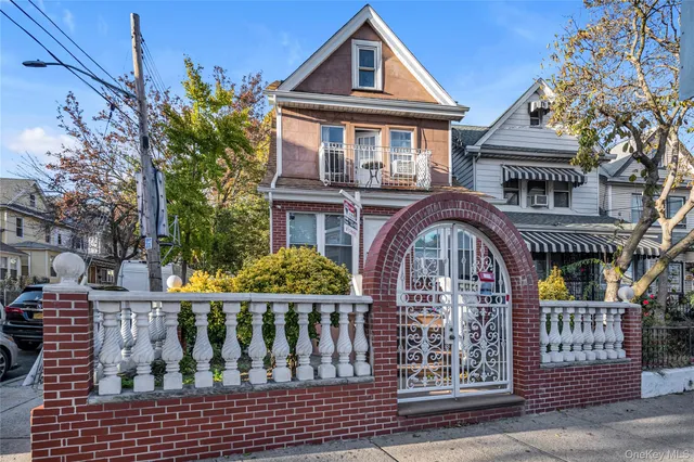 a front view of house with a garden