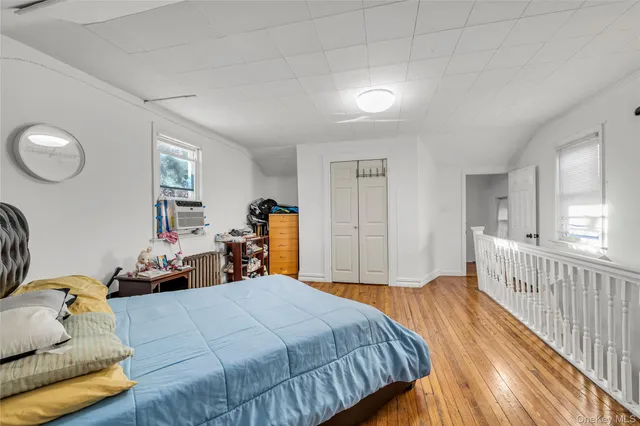 a bedroom with furniture and a bed