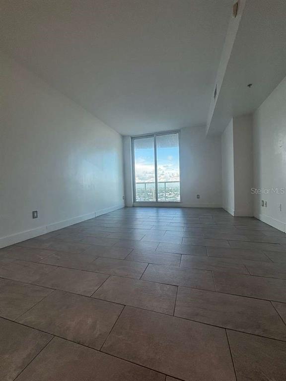 315 Northeast 3rd Avenue, Unit 2009 Fort Lauderdale, FL 33301 - Photo 5 of 11 a view of an empty room with a window