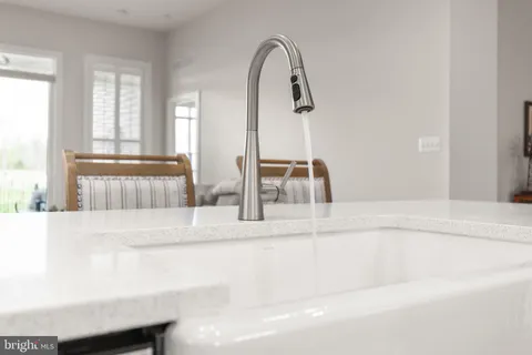 a view of a bathroom with bathtub and window