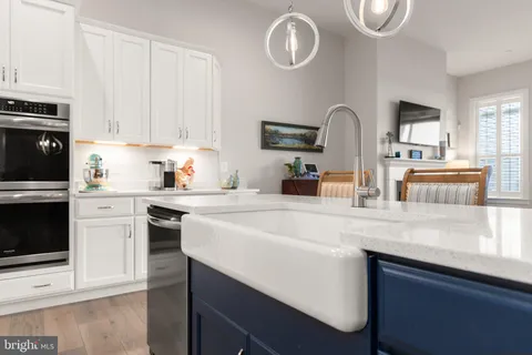 a kitchen with appliances cabinets and a sink