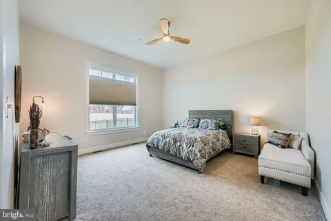 a bedroom with bed and window