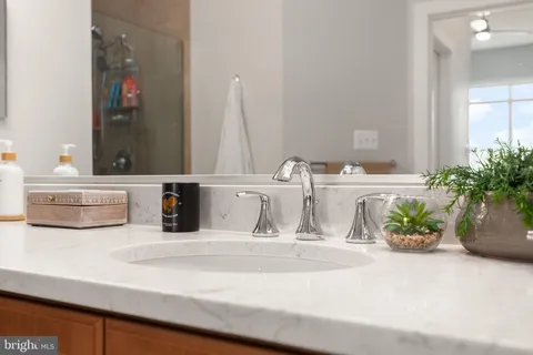 a bathroom with a sink a vanity and a mirror