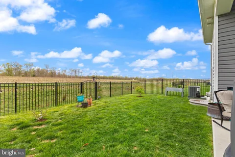 a view of a garden with a building in the background