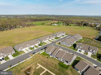 an aerial view of a city with ocean view