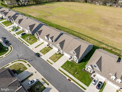an aerial view of a house with outdoor space