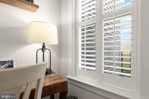 a room with a table and a window