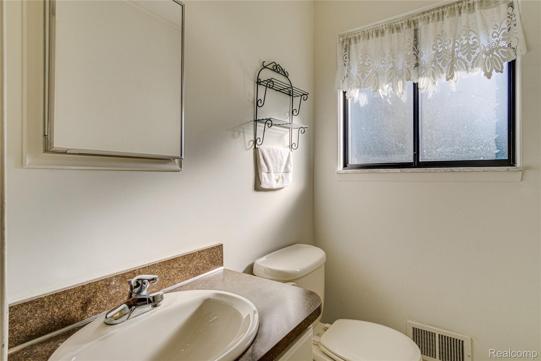 605 Castlebar Drive Rochester, MI 48309 - Photo 10 of 26 1 of 2 half baths, this one off the kitchen and garage