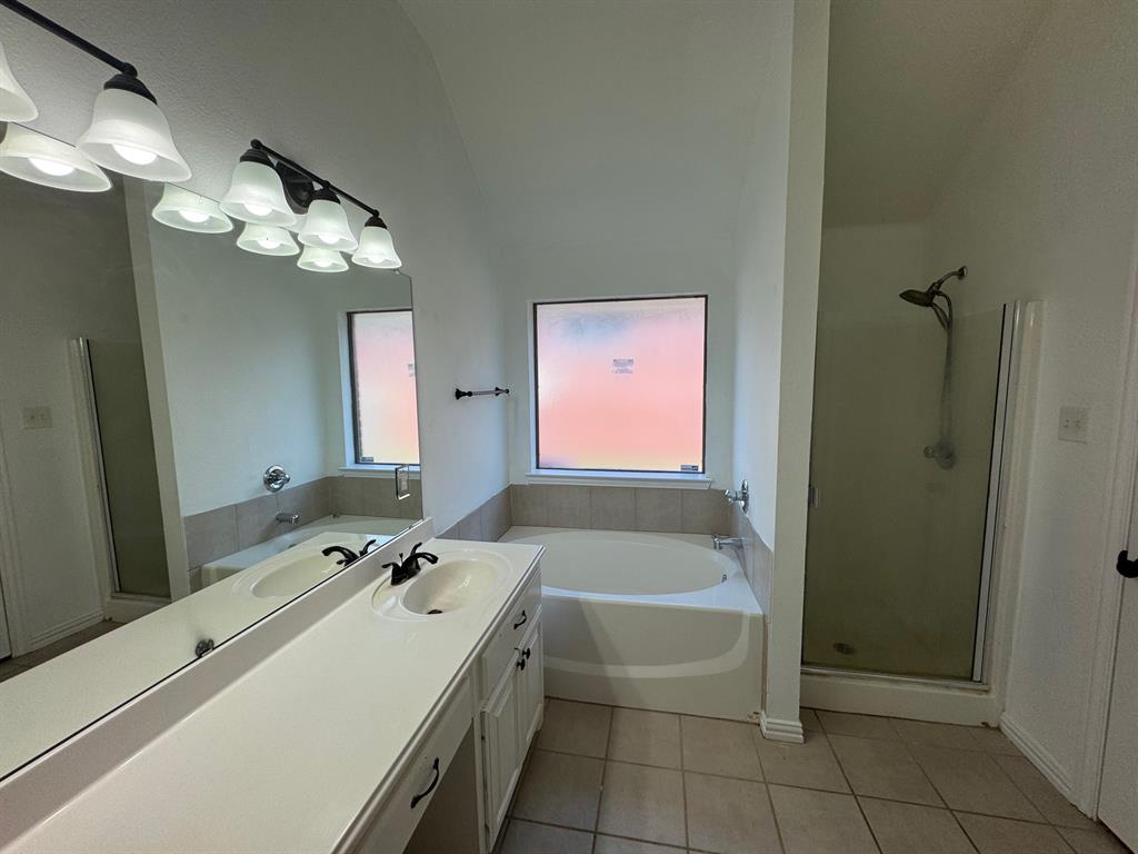 6611 Rockdale Road Fort Worth, TX 76134 - Photo 14 of 32 a bathroom with a tub sink and mirror