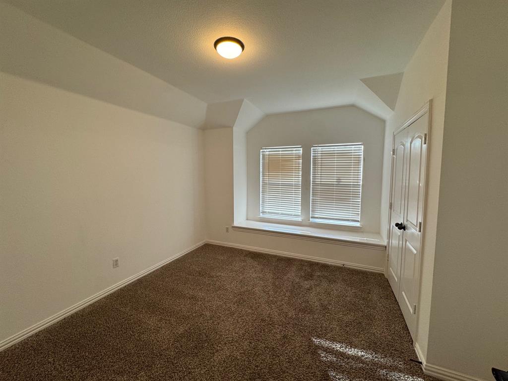6611 Rockdale Road Fort Worth, TX 76134 - Photo 17 of 32 an empty room with a window