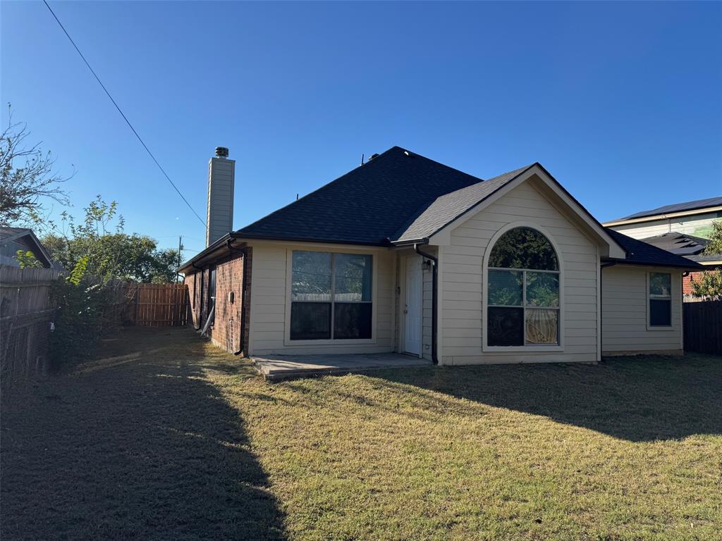 6611 Rockdale Road Fort Worth, TX 76134 - Photo 25 of 32 a front view of a house with a yard