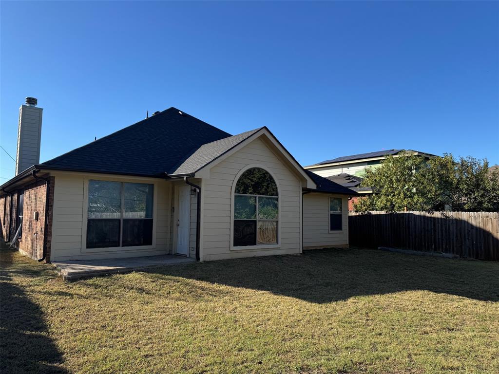 6611 Rockdale Road Fort Worth, TX 76134 - Photo 26 of 32 a front view of a house with a yard