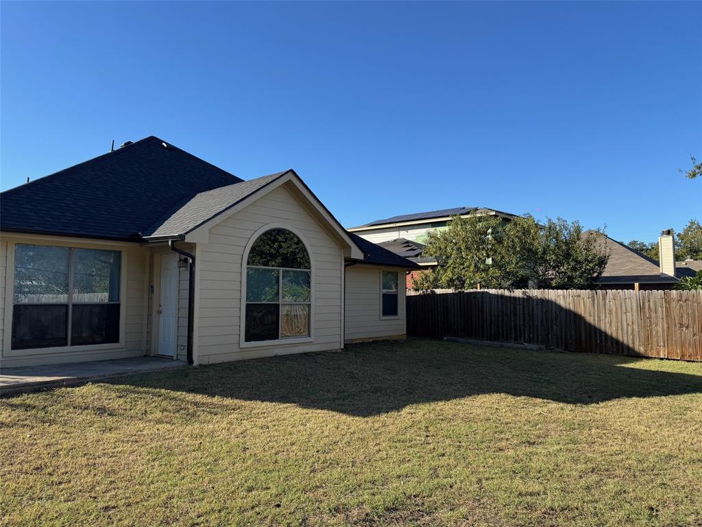 6611 Rockdale Road Fort Worth, TX 76134 - Photo 27 of 32 a front view of a house with a yard