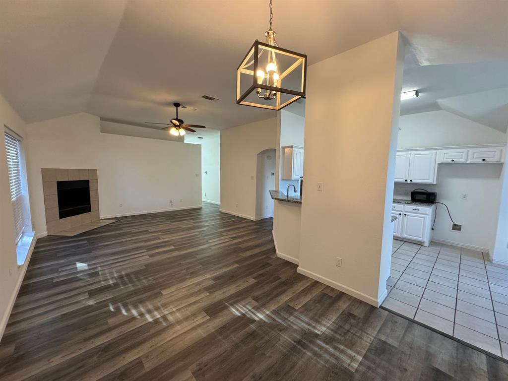6611 Rockdale Road Fort Worth, TX 76134 - Photo 4 of 32 an empty room with wooden floor and windows
