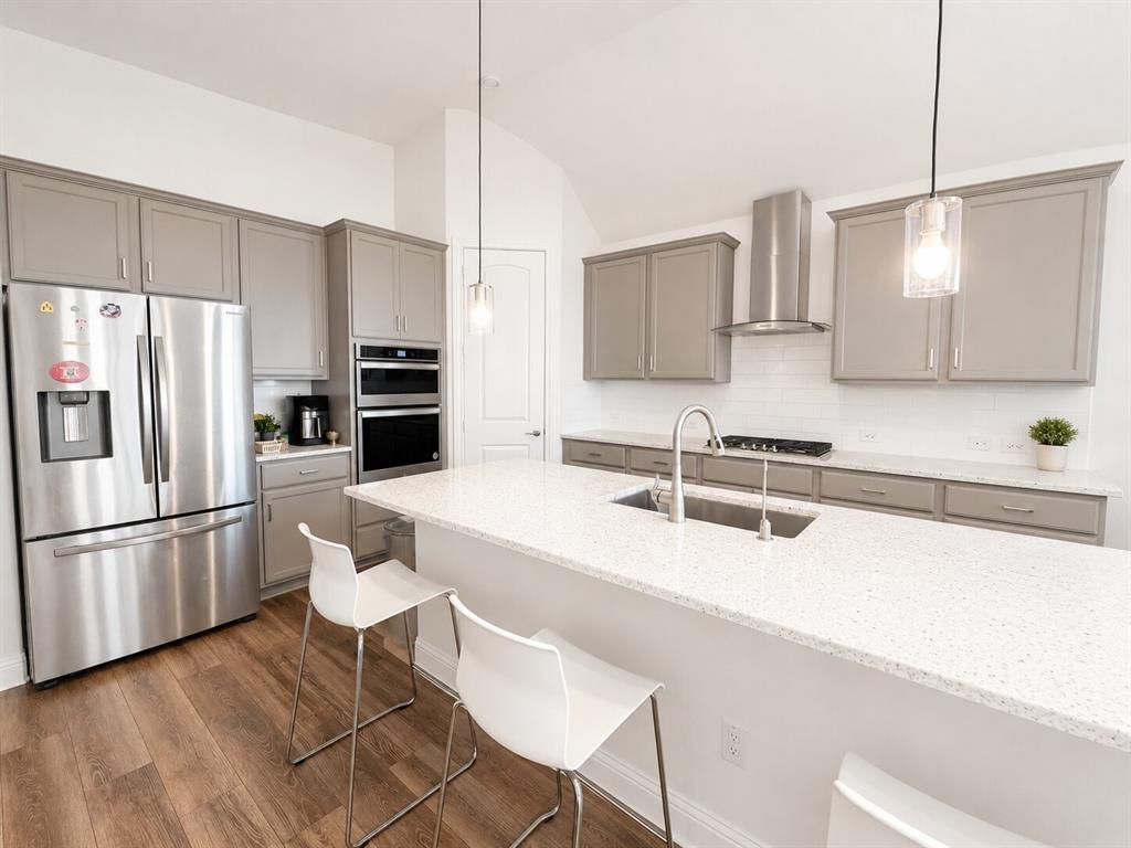 3598 Furrow Road Frisco, TX 75035 - Photo 7 of 14 a kitchen with stainless steel appliances a sink and a refrigerator