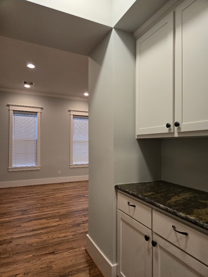 4109 Allen Street Houston, TX 77007 - Photo 12 of 42 Built-in storage nook area with cabinets and drawers for extra storage. View into dining room.