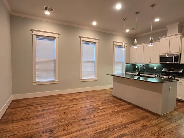 a view of a livingroom with a ceiling fan and window