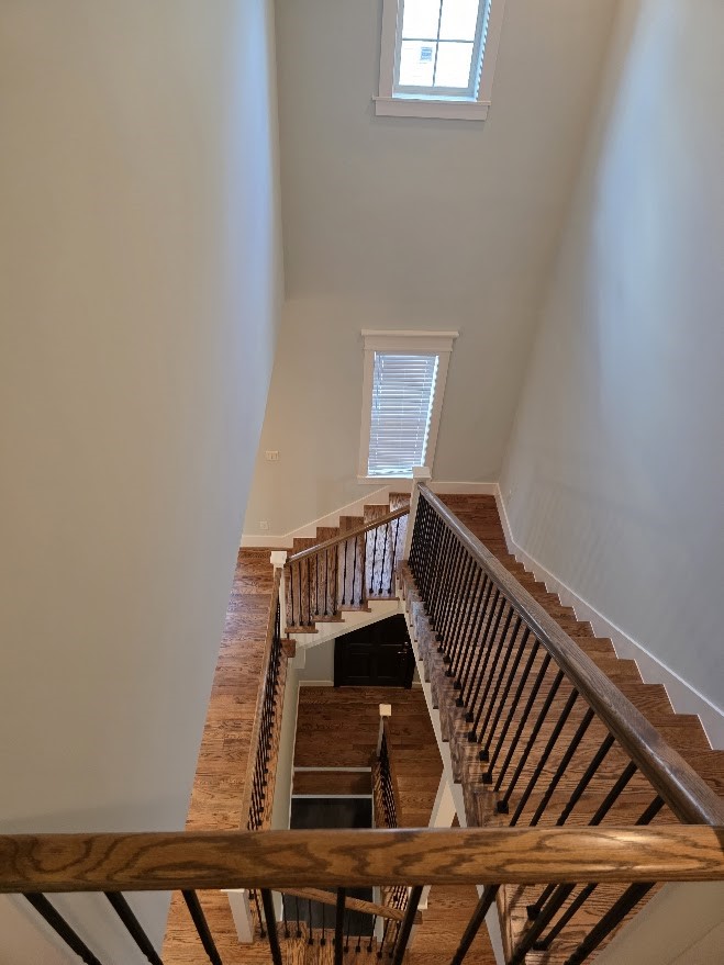 4109 Allen Street Houston, TX 77007 - Photo 37 of 42 Towering view from the top of the stairs on the 3rd floor landing down to the 1st floor. and front door entryway.