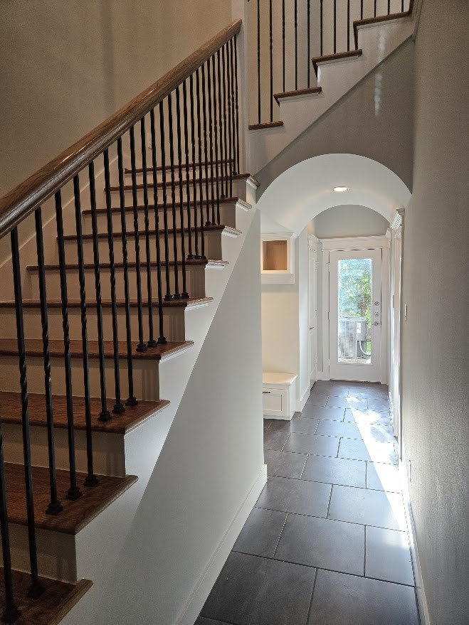 4109 Allen Street Houston, TX 77007 - Photo 4 of 42 Head straight to your backyard or the 1st floor bedroom. Two storage closets and storage bench are also on the 1st floor. Access garage on 1st floor too. Stairs to 2nd floor.