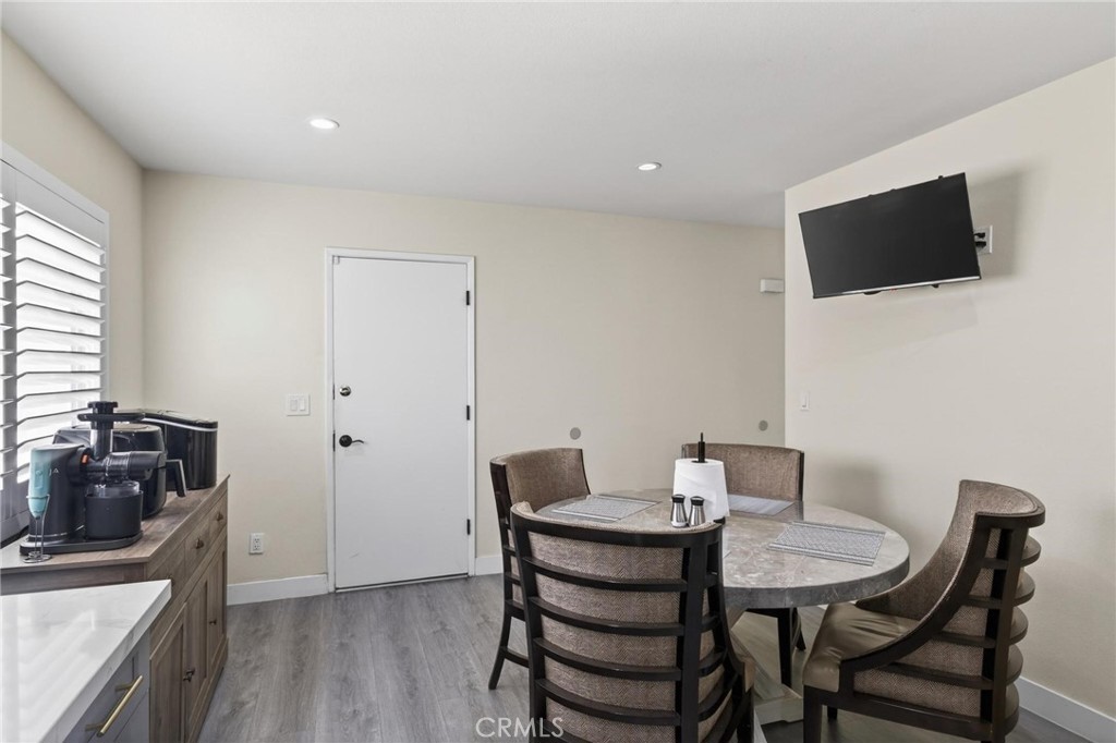 910 East Meadbrook Street Carson, CA 90746 - Photo 17 of 39 a view of a dining room with furniture and wooden floor