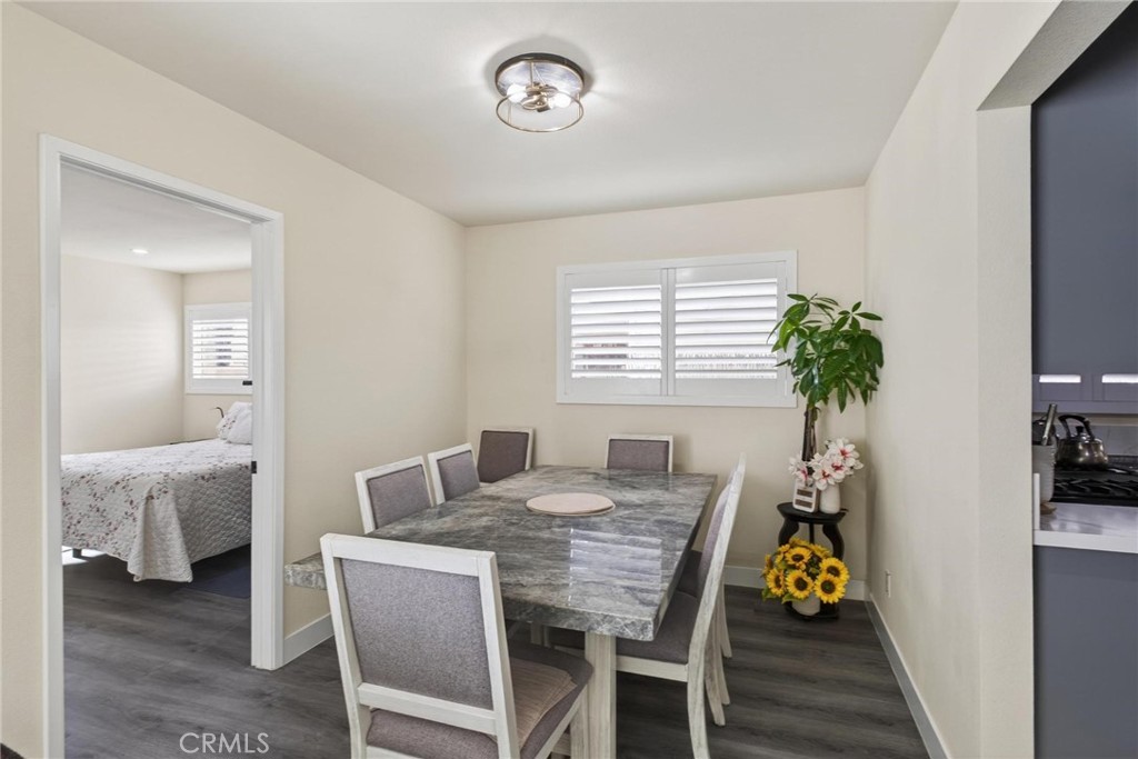 910 East Meadbrook Street Carson, CA 90746 - Photo 18 of 39 a view of a dining room with furniture and a potted plant