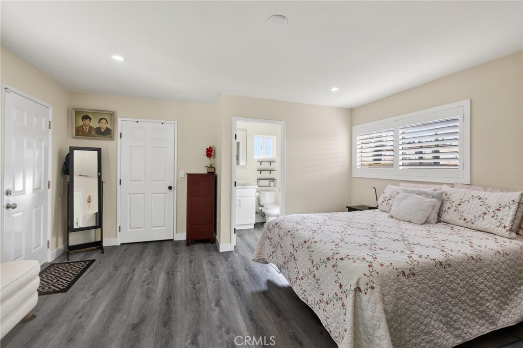 910 East Meadbrook Street Carson, CA 90746 - Photo 20 of 39 a bedroom with a bed and a window