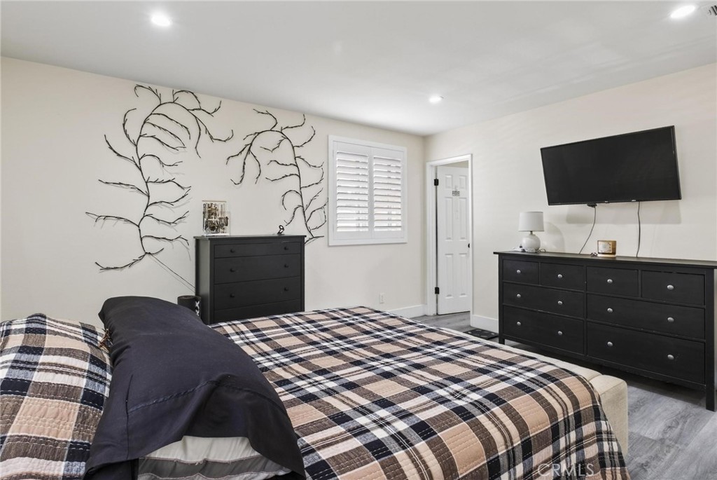 910 East Meadbrook Street Carson, CA 90746 - Photo 22 of 39 a bedroom with a bed and a flat screen tv