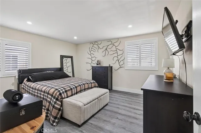 a bedroom with a bed and a desk