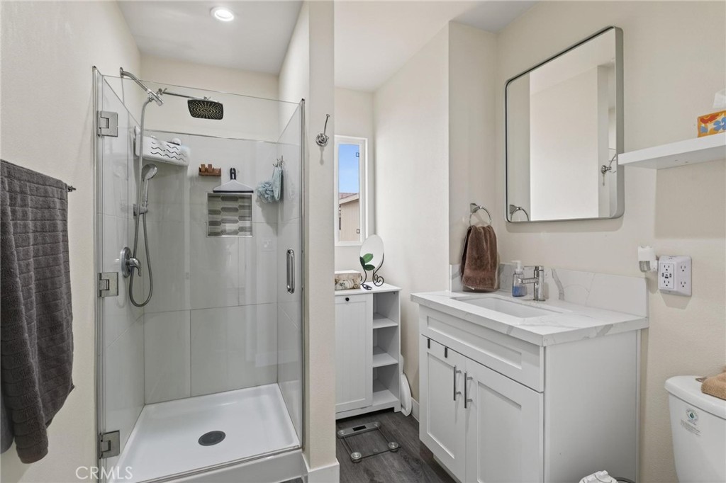 910 East Meadbrook Street Carson, CA 90746 - Photo 24 of 39 a bathroom with a shower sink and mirror