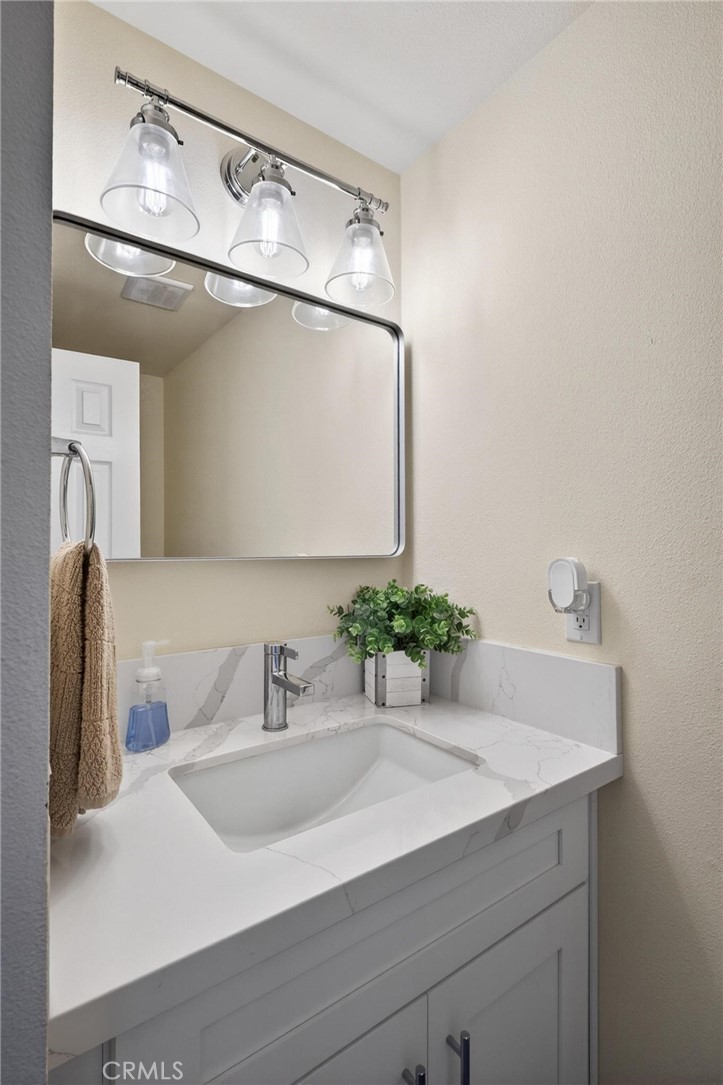 910 East Meadbrook Street Carson, CA 90746 - Photo 25 of 39 a bathroom with a sink and a mirror