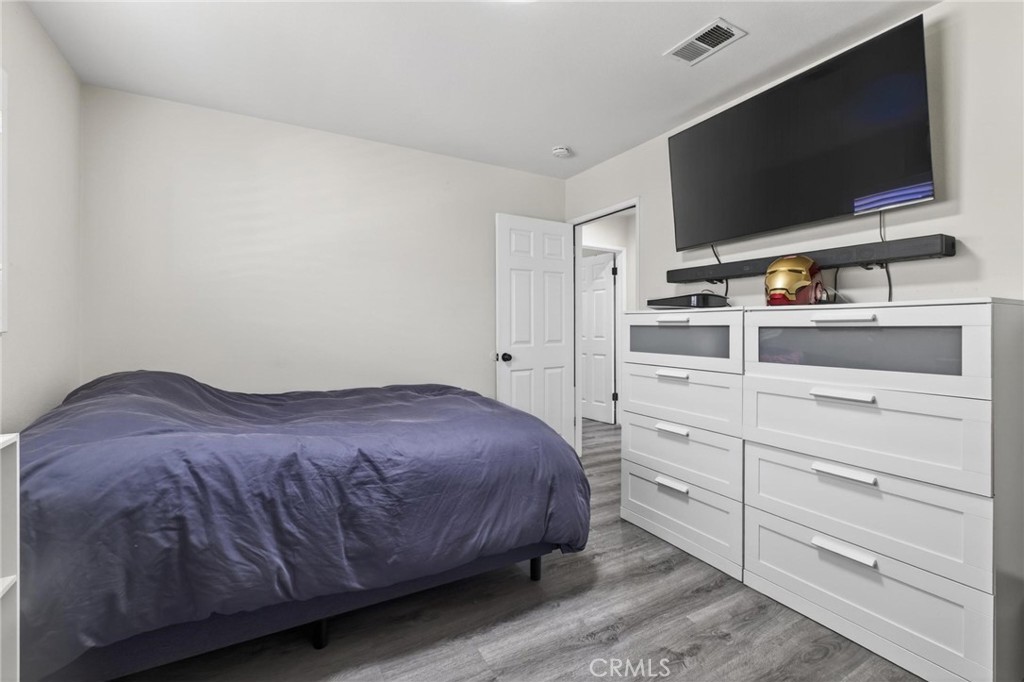 910 East Meadbrook Street Carson, CA 90746 - Photo 32 of 39 a bedroom with a bed and a flat screen tv