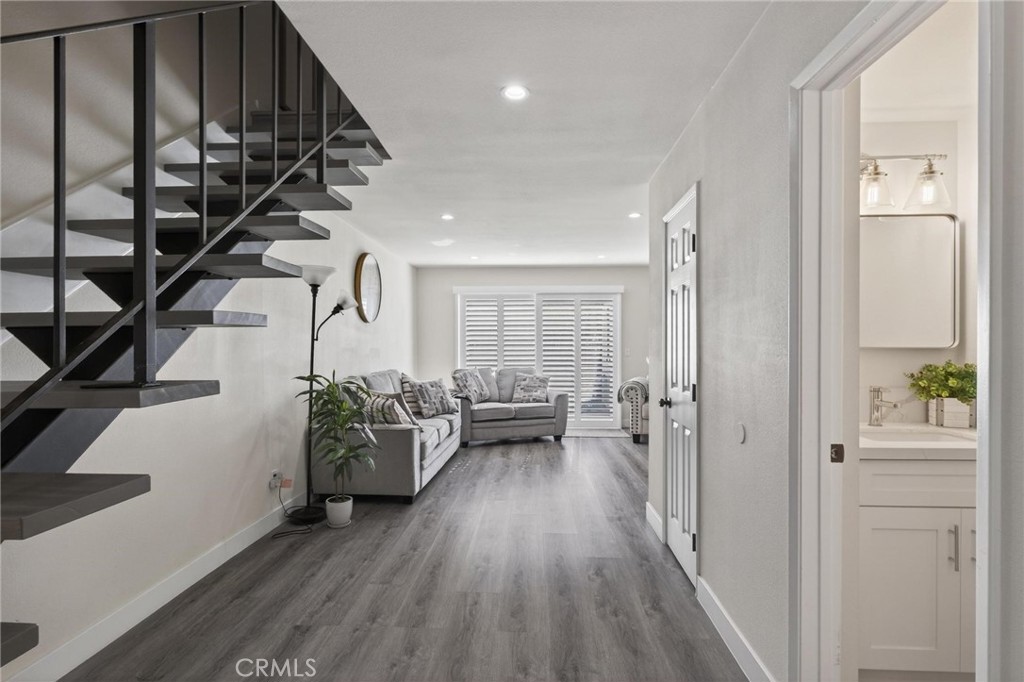 910 East Meadbrook Street Carson, CA 90746 - Photo 6 of 39 a living room with furniture and wooden floor