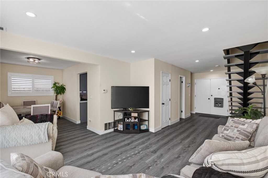 910 East Meadbrook Street Carson, CA 90746 - Photo 8 of 39 a living room with furniture and a flat screen tv