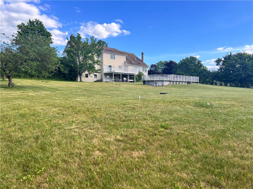 630 Clearfield Road Nazareth, PA 18064 - Photo 5 of 8 A spacious backyard with an above-ground pool and ample green space for outdoor activities.
