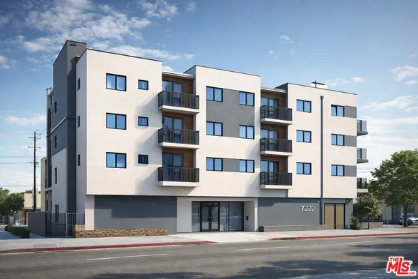 a front view of a building with a street