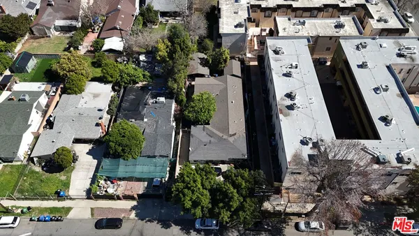 an aerial view of residential house with outdoor space and parking