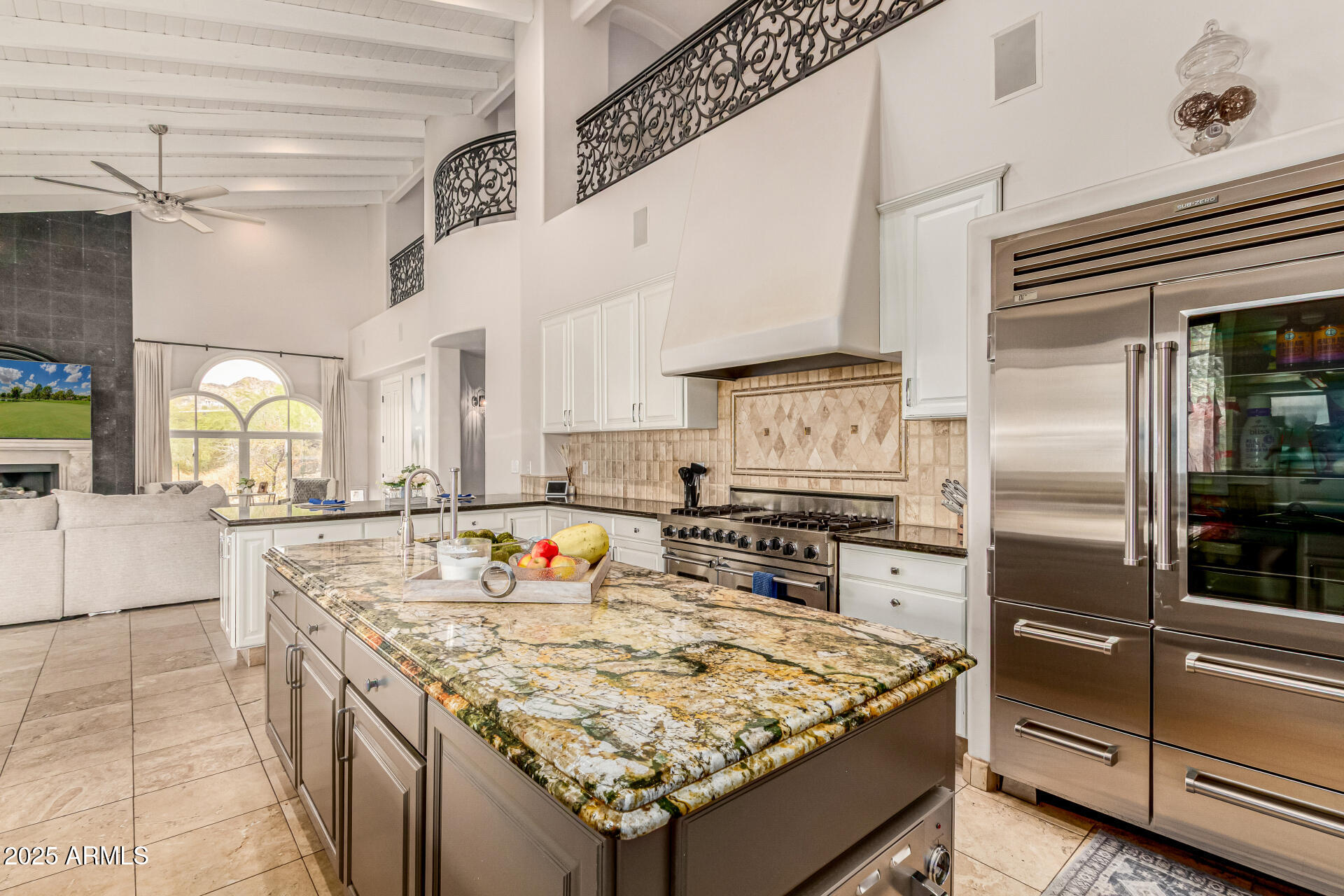 6050 North Paradise View Drive Paradise Valley, AZ 85253 - Photo 18 of 79 a kitchen with stainless steel appliances granite countertop a sink stove and refrigerator
