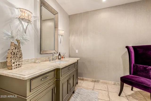 a large bathroom with a double vanity sink mirror and shower