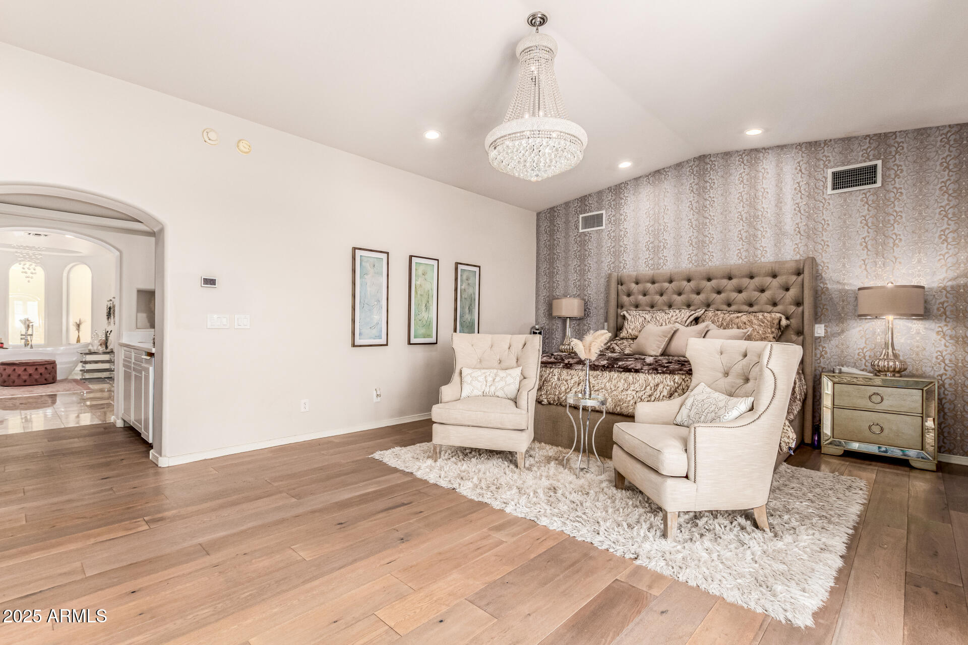 6050 North Paradise View Drive Paradise Valley, AZ 85253 - Photo 27 of 79 a living room with furniture and a chandelier