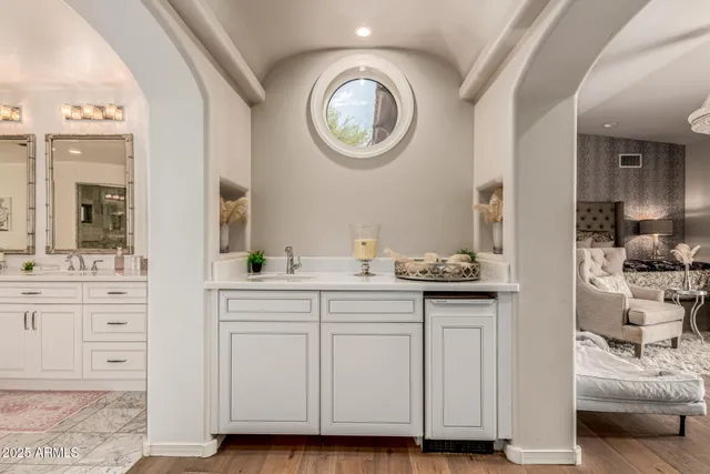 a living room with a bed furniture and a window