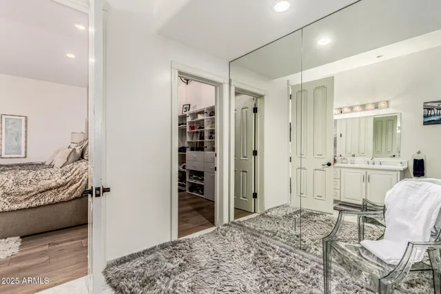 a spacious bedroom with a bed and a couch