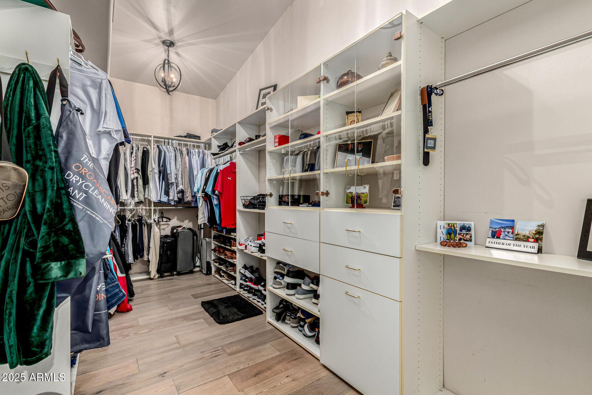 6050 North Paradise View Drive Paradise Valley, AZ 85253 - Photo 39 of 79 a view of walk in closet with clothes and shoes