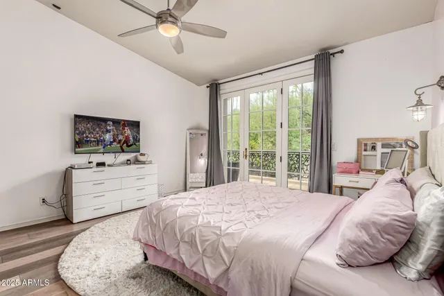 a bedroom with a bed and a couch